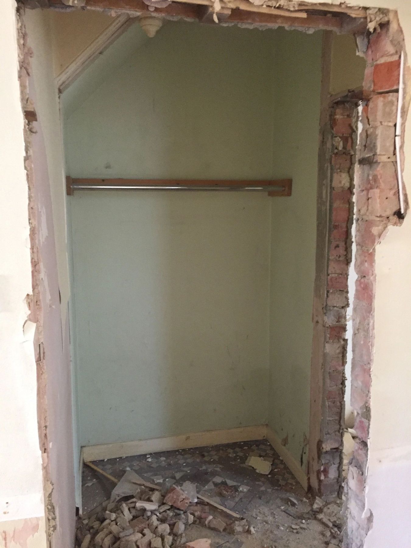 The old cupboard under the stairs, stripped back
