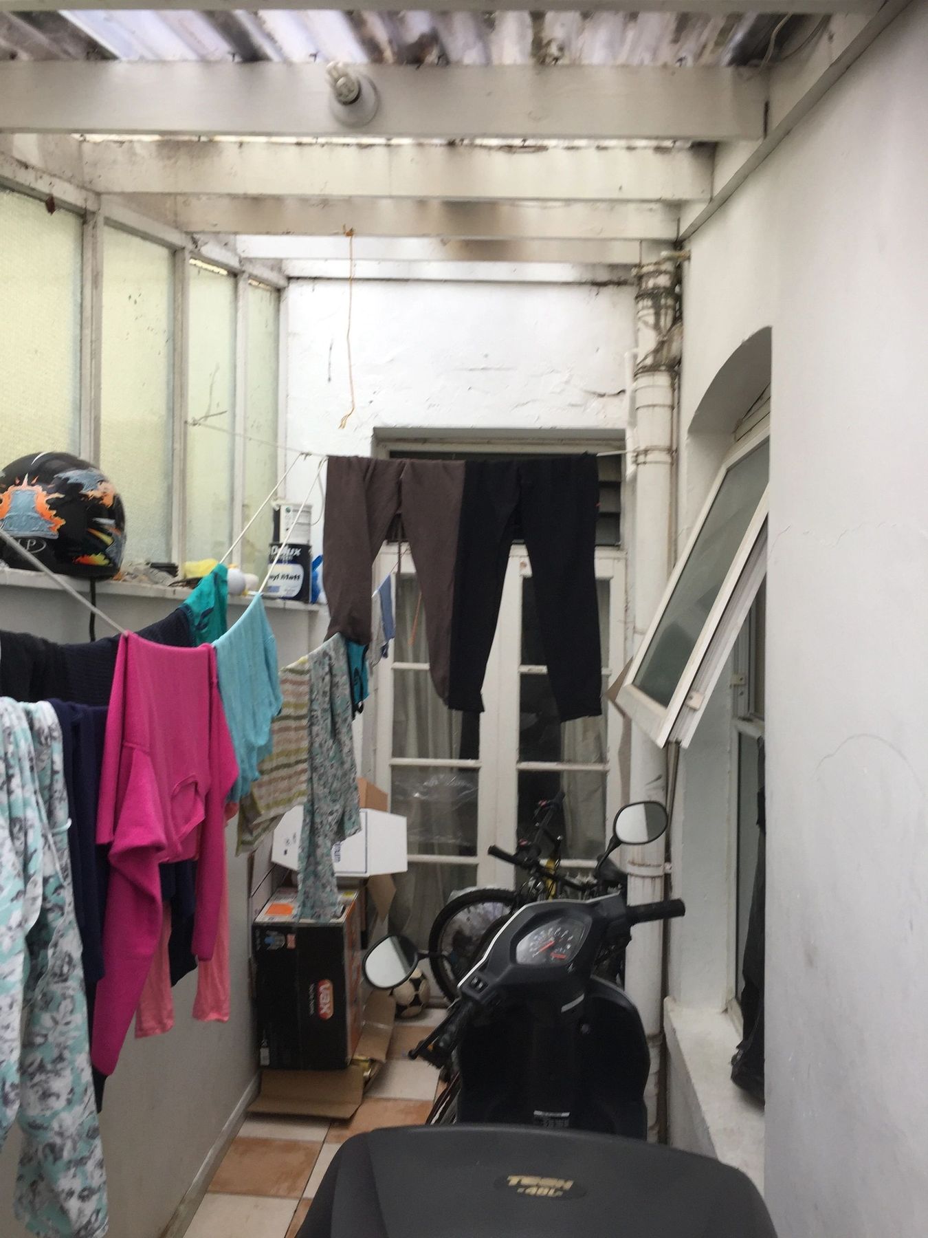 The cluttered outside space before the extension